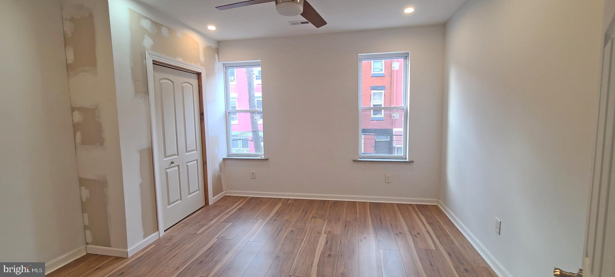 1817 North 26th Street Philadelphia, PA 19121 - Photo 12 of 25 a view of hallway with window and wooden floor