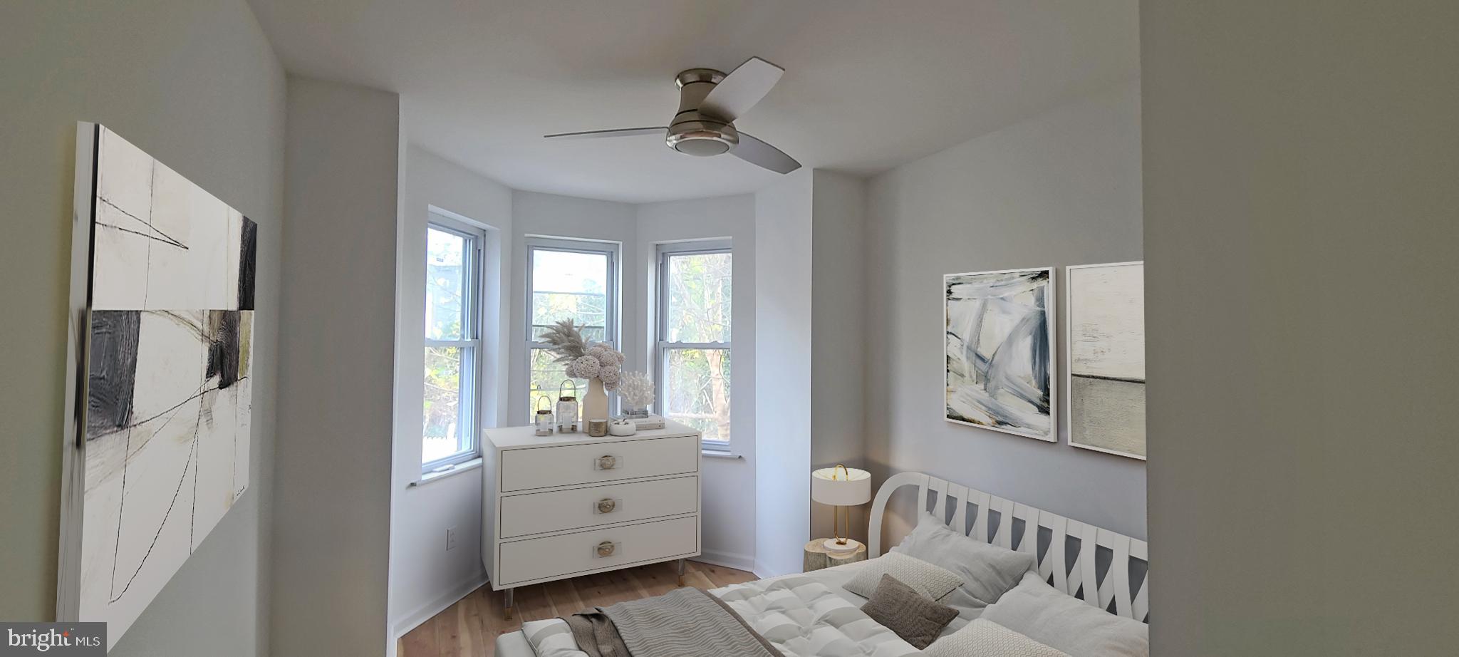 1817 North 26th Street Philadelphia, PA 19121 - Photo 16 of 25 a bedroom with furniture and a window
