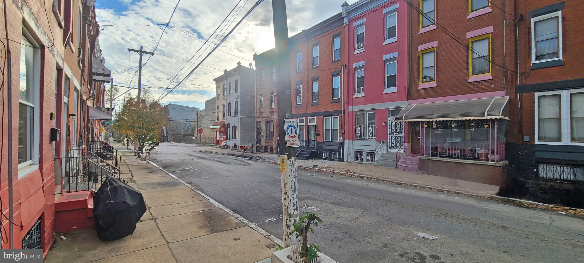 1817 North 26th Street Philadelphia, PA 19121 - Photo 25 of 25 a view of a brick building with a bench in front of building