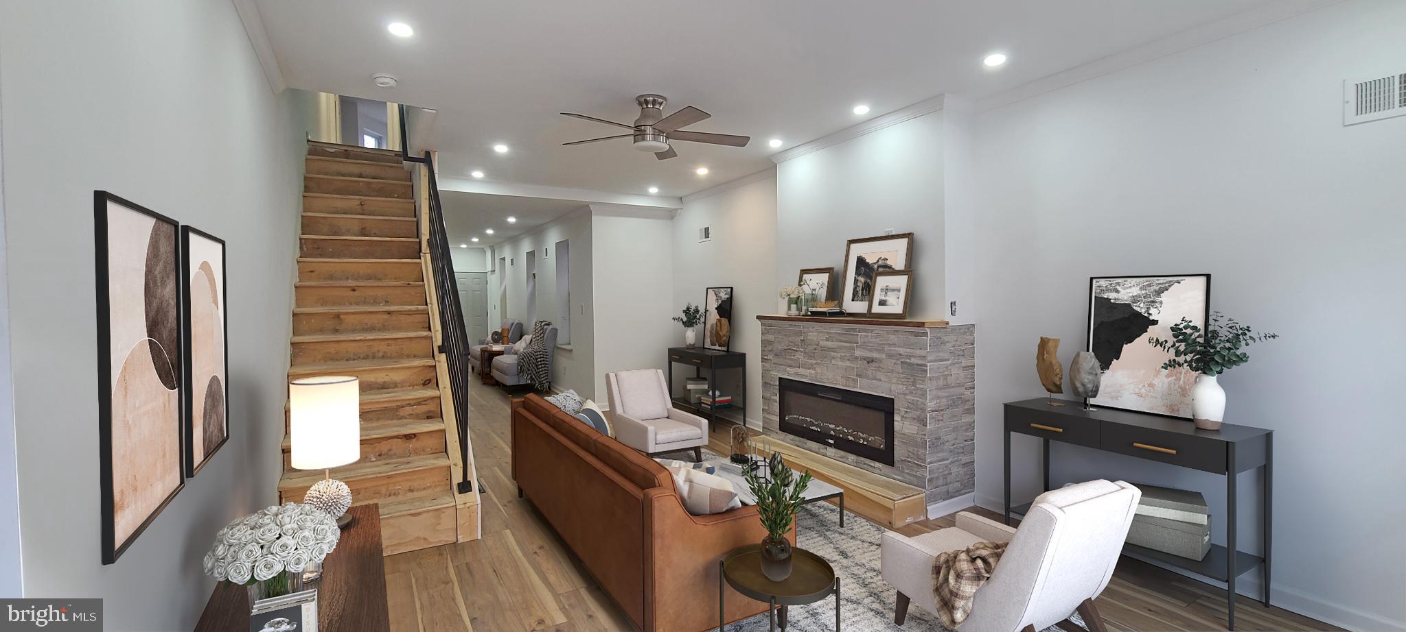 1817 North 26th Street Philadelphia, PA 19121 - Photo 3 of 25 a living room with furniture and a fireplace