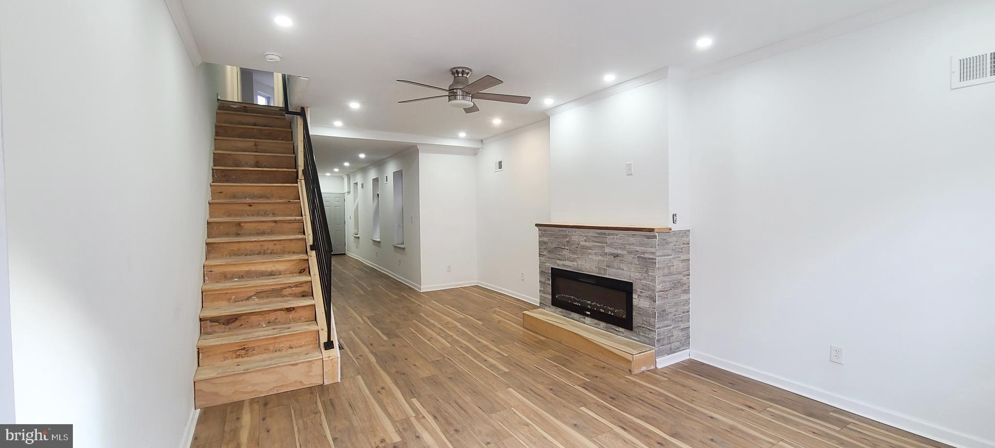 1817 North 26th Street Philadelphia, PA 19121 - Photo 4 of 25 an entryway in a room with a fireplace and entryway