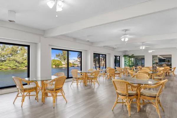 a dining room with furniture window wooden floor and outside view