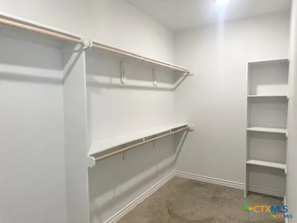 a view of an empty walk in closet