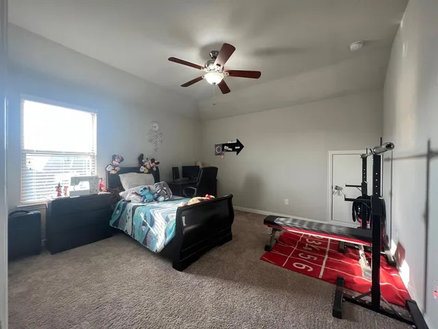 a bed room with a bed and a window