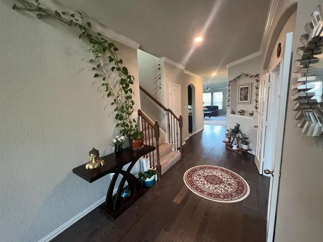 a view of entryway with a table and a chandelier