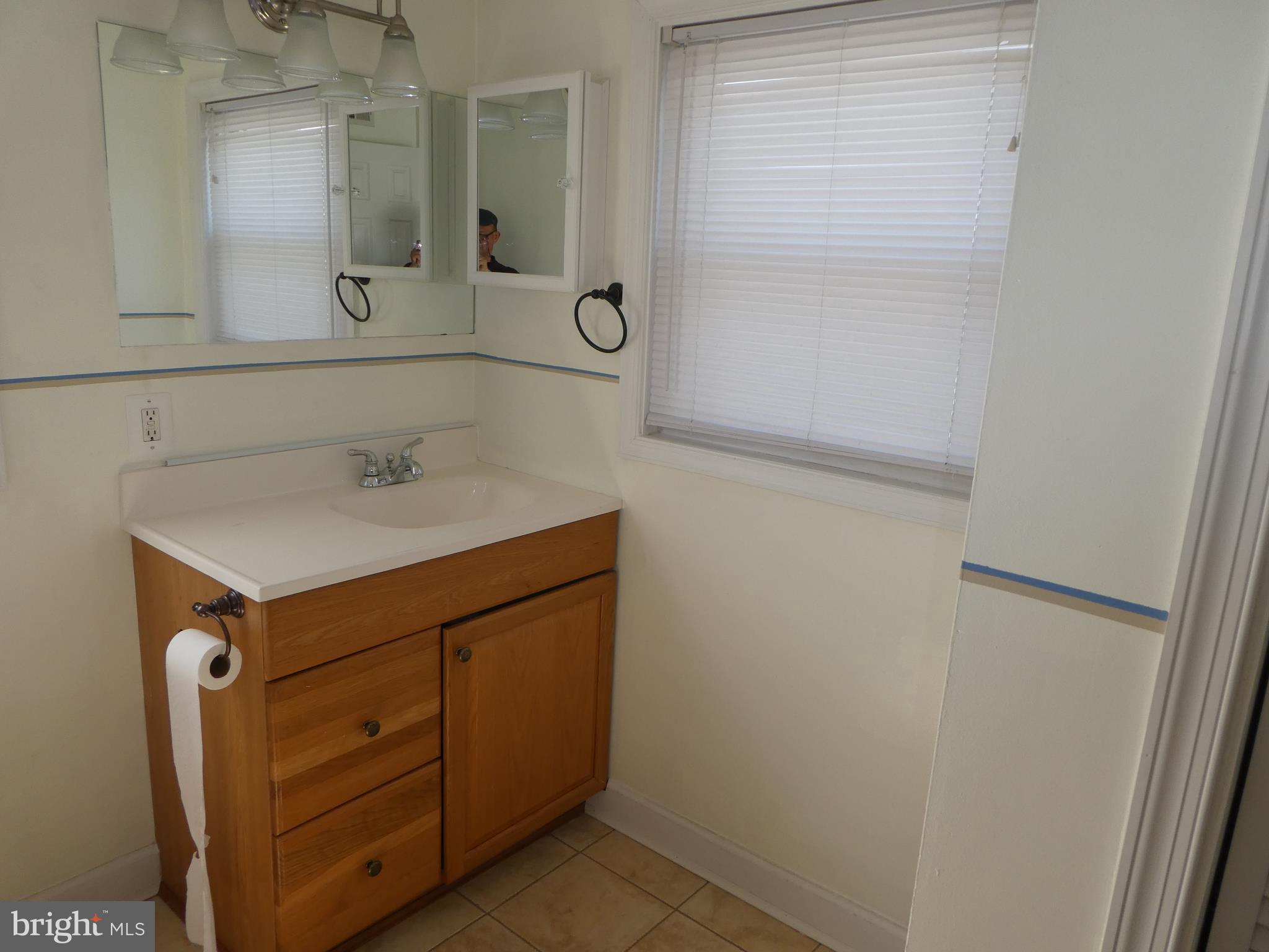 402 C Street, Unit 203 Quantico, VA 22134 - Photo 11 of 14 a bathroom with a sink and a mirror