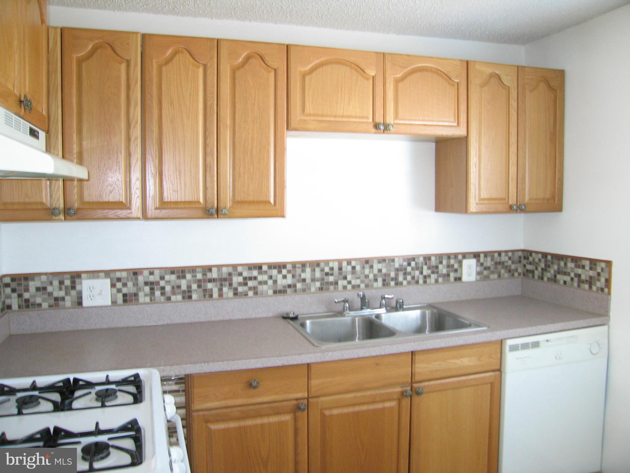 402 C Street, Unit 203 Quantico, VA 22134 - Photo 2 of 14 a bathroom with a sink and a cabinets