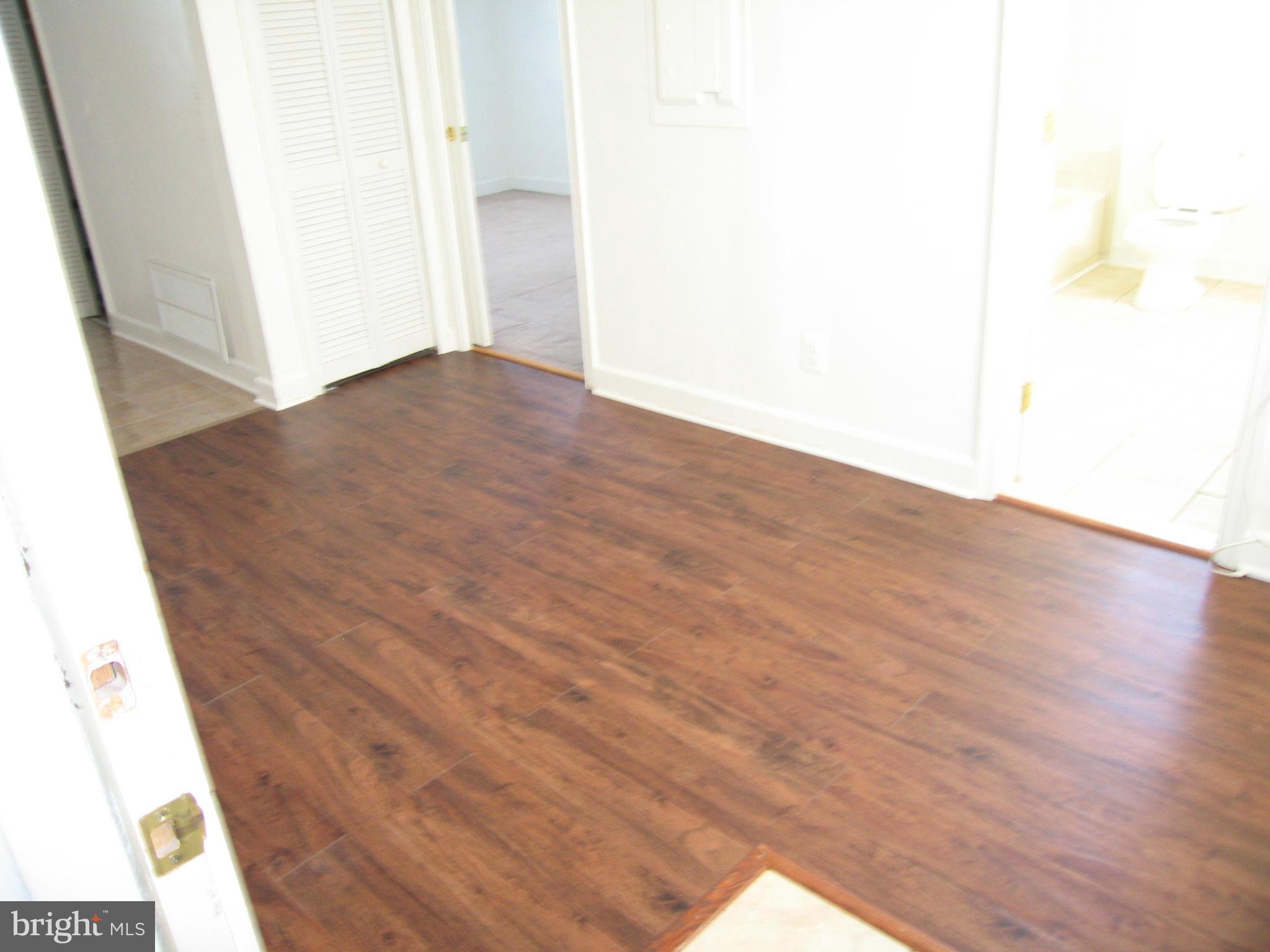 402 C Street, Unit 203 Quantico, VA 22134 - Photo 6 of 14 a view of an empty room and wooden floor