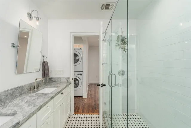 a view of a hallway with washer and dryer