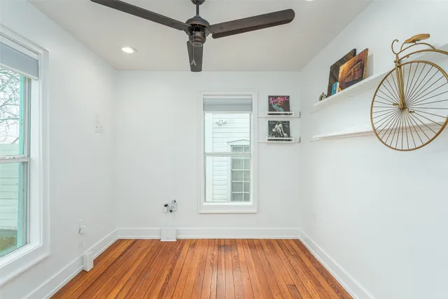 a view of a room with wooden floor cabinets and a window