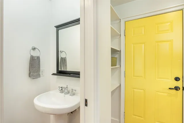 a view of a house with a yard in front of it