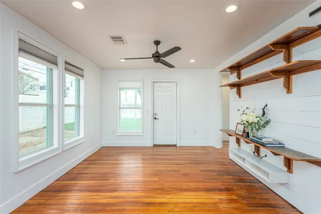 a kitchen with stainless steel appliances a stove refrigerator sink and cabinets