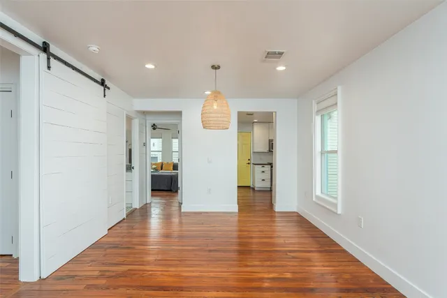 a kitchen with stainless steel appliances a stove microwave and sink