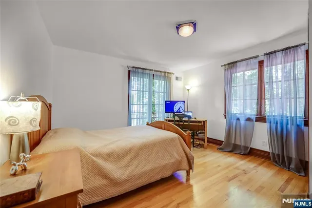 a bedroom with a bed and a table