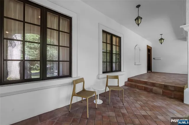a living room with furniture and windows