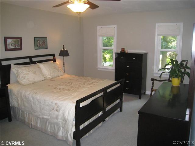 606 Watch Hill Road Midlothian, VA 23114 - Photo 8 of 12 a bedroom with a bed and a dresser