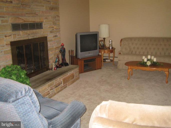 16209 Manning Road West Accokeek, MD 20607 - Photo 8 of 18 a living room with furniture and a flat screen tv