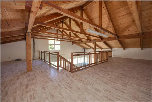 a kitchen with stainless steel appliances a sink stove and cabinets