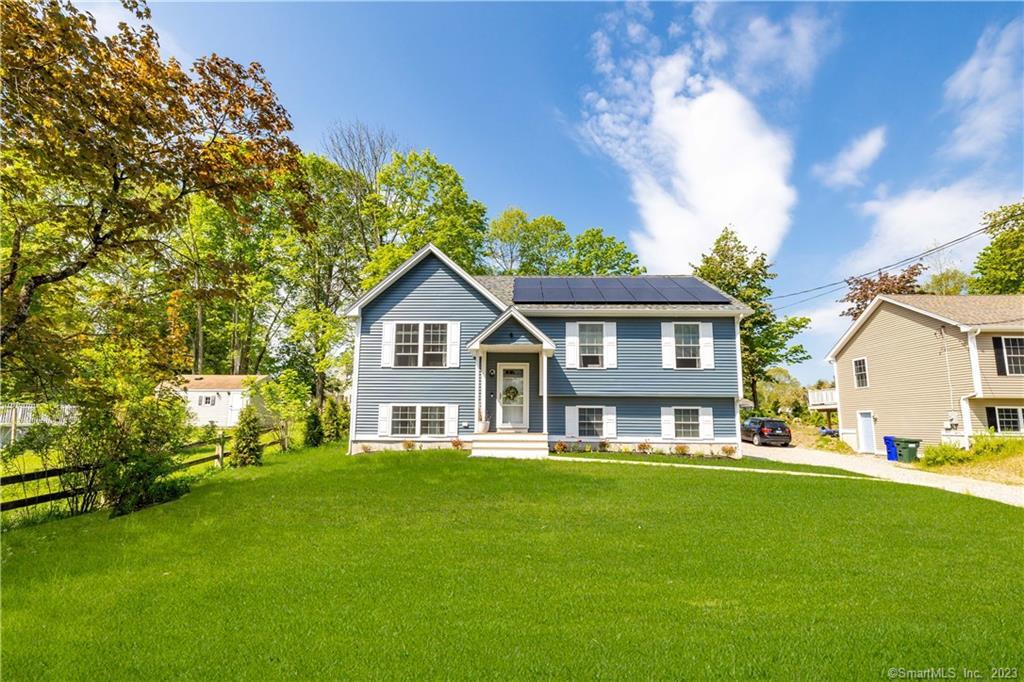 339 Norwich-Westerly Road North Stonington, CT 06359 - Photo 1 of 1 a front view of house with yard and green space