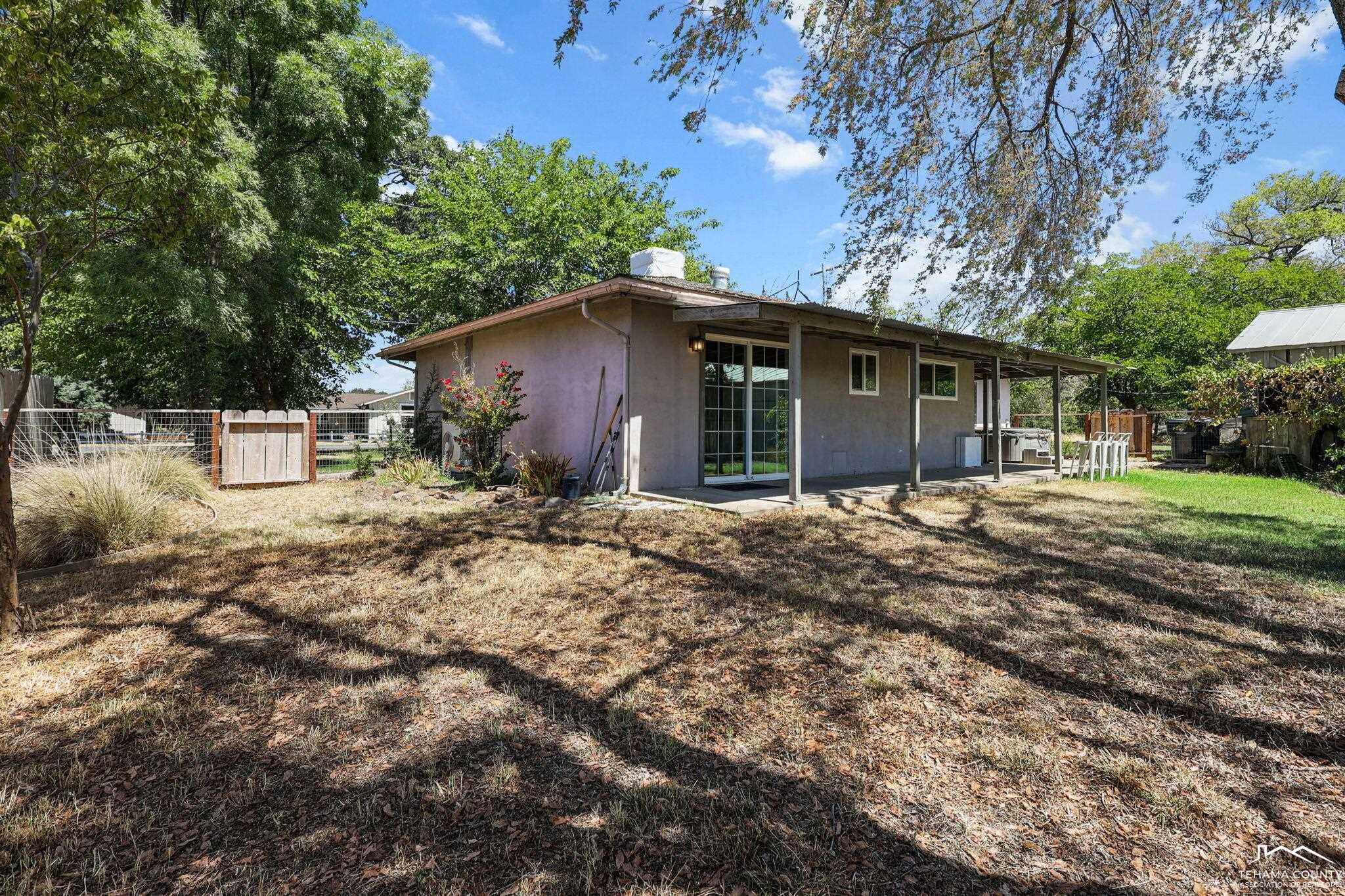 22275 Brent Road Red Bluff, CA 96080 - Photo 27 of 47 a view of a house with a yard and large tree