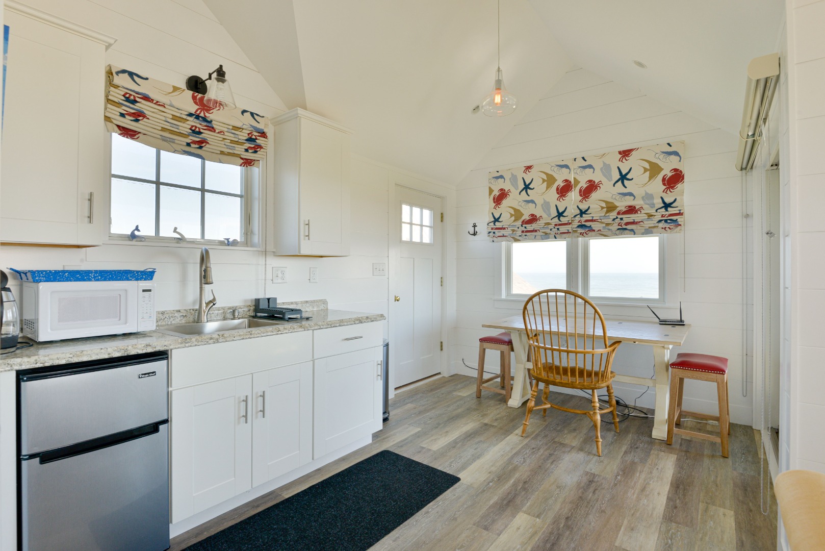 56 R Madequecham Valley Road Nantucket, MA 02554 - Photo 46 of 52 a kitchen with stainless steel appliances granite countertop a stove a sink dishwasher and cabinets with wooden floor