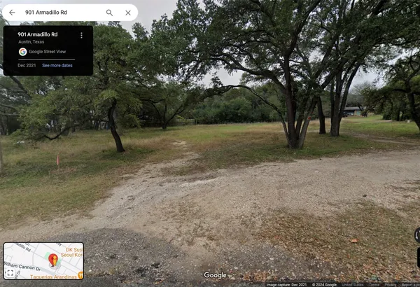 a view of a white building among the street