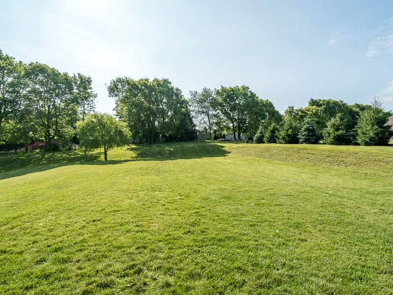 9683 Rambouillet Ridge Roscoe, IL 61073 - Photo 23 of 25 a view of a green yard