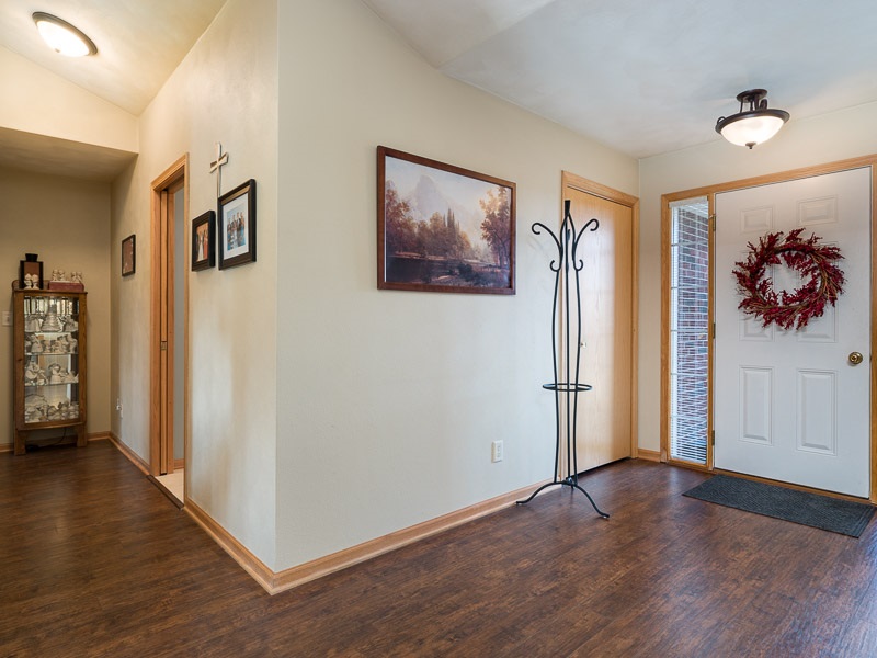 9683 Rambouillet Ridge Roscoe, IL 61073 - Photo 3 of 25 a view of a livingroom with wooden floor and a ceiling fan