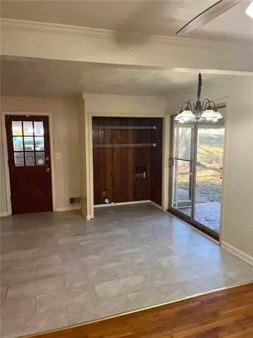 a view of an empty room and window