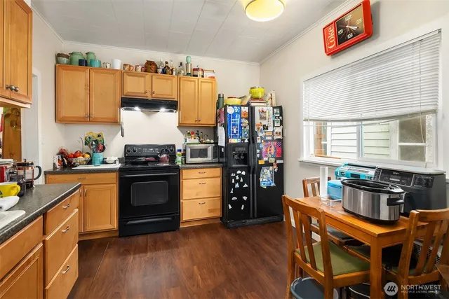 a kitchen with stainless steel appliances granite countertop a stove and a refrigerator
