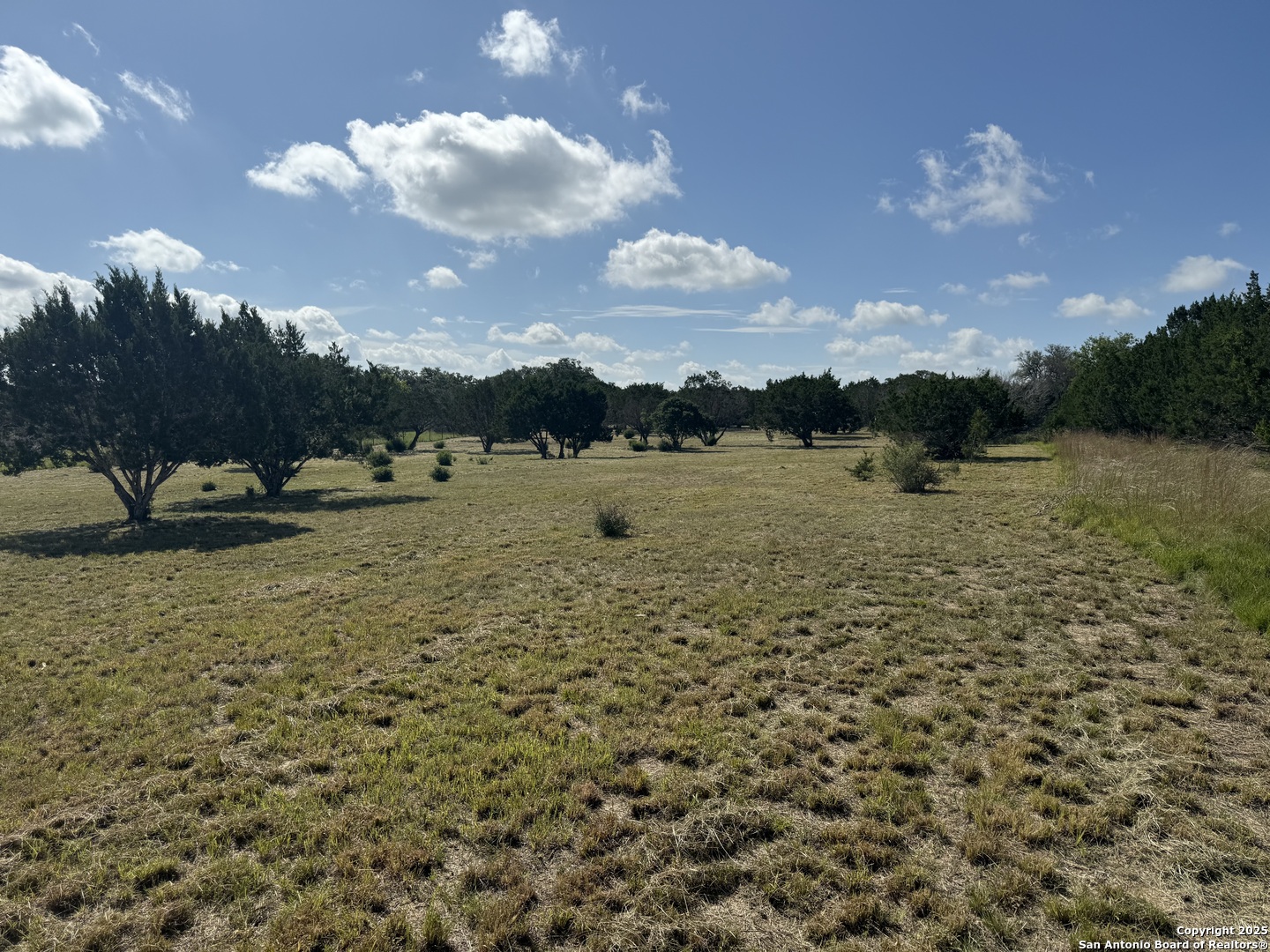 1268 Lariat Bandera, TX 78003 - Photo 6 of 10 a view of a lake with houses