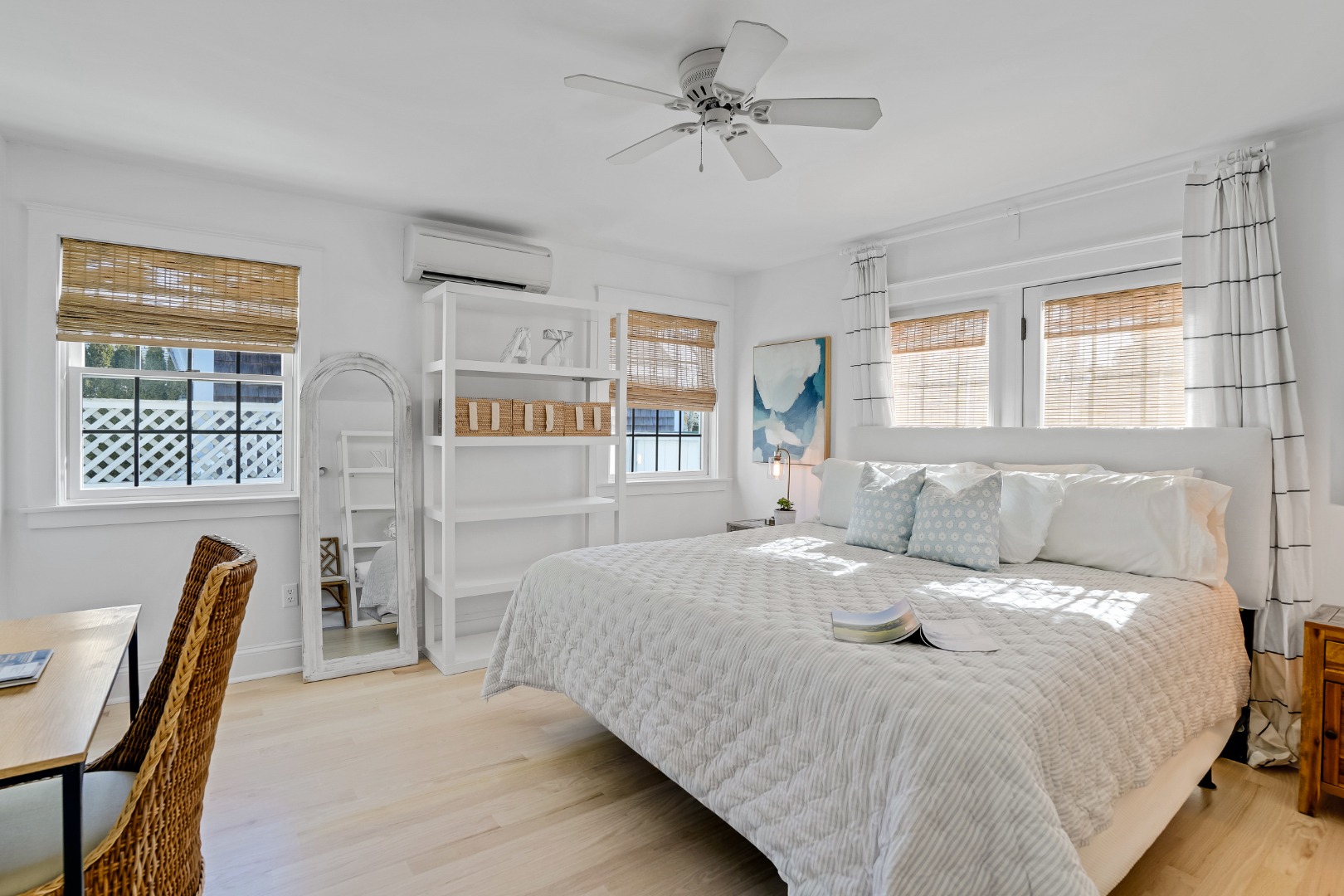 99 Cooke Street Edgartown, MA 02539 - Photo 14 of 26 a bedroom with a bed next to a window with a dresser