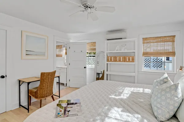 a bedroom with furniture and a window