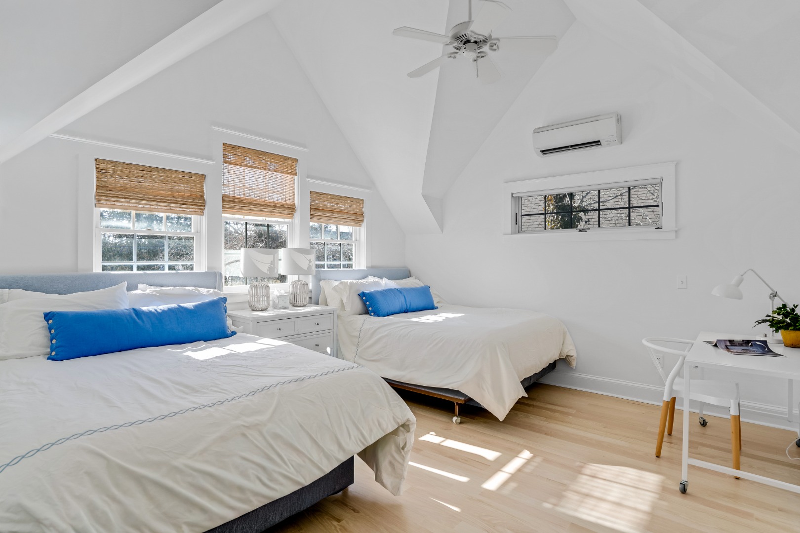 99 Cooke Street Edgartown, MA 02539 - Photo 17 of 26 a bedroom with two beds and a large window