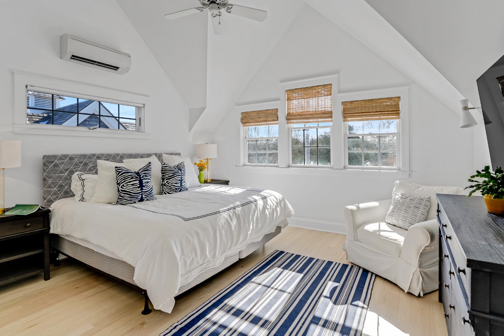 99 Cooke Street Edgartown, MA 02539 - Photo 19 of 26 a bedroom with a bed and wooden floor