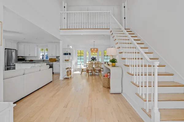 a view of kitchen with furniture and wooden floor