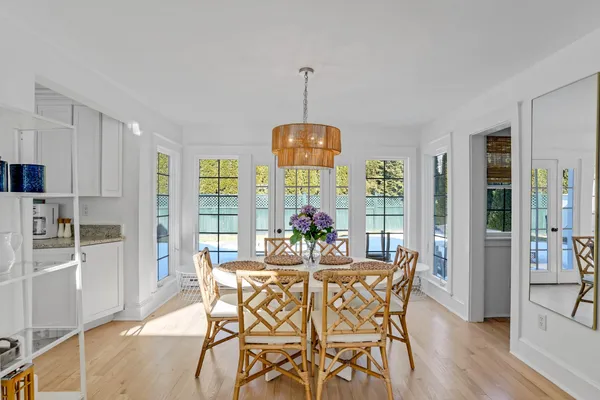 a dining room with furniture window wooden floor