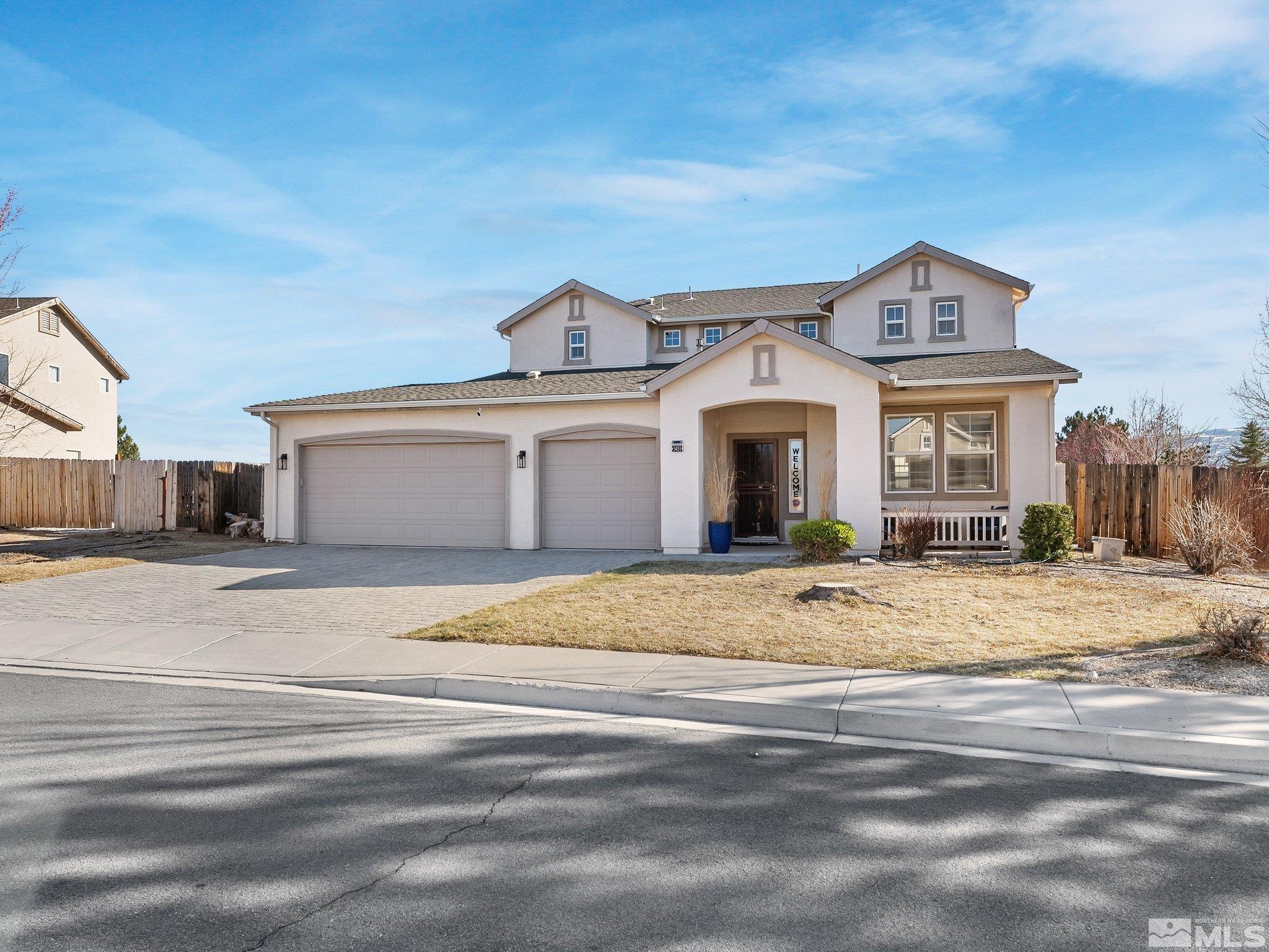 3451 Weaver Place Reno, NV 89512 - Photo 2 of 40 a front view of a house with a yard