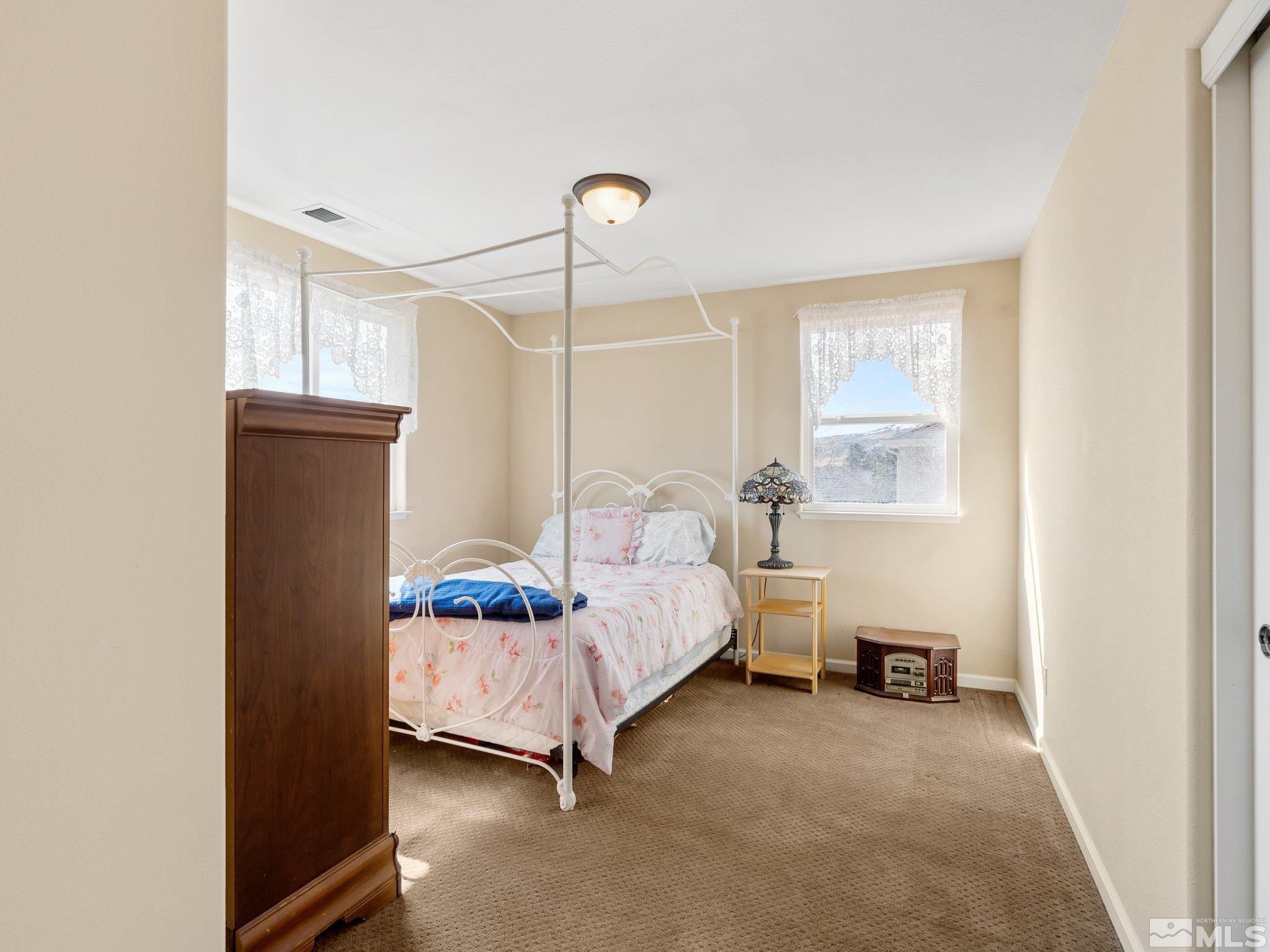 3451 Weaver Place Reno, NV 89512 - Photo 26 of 40 a bedroom with a bed and a window