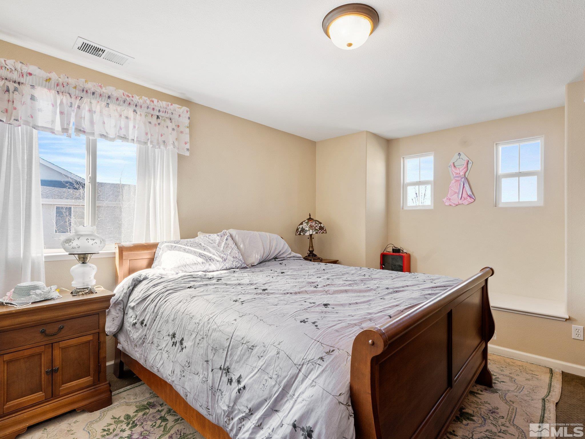 3451 Weaver Place Reno, NV 89512 - Photo 28 of 40 a bedroom with a bed and a window