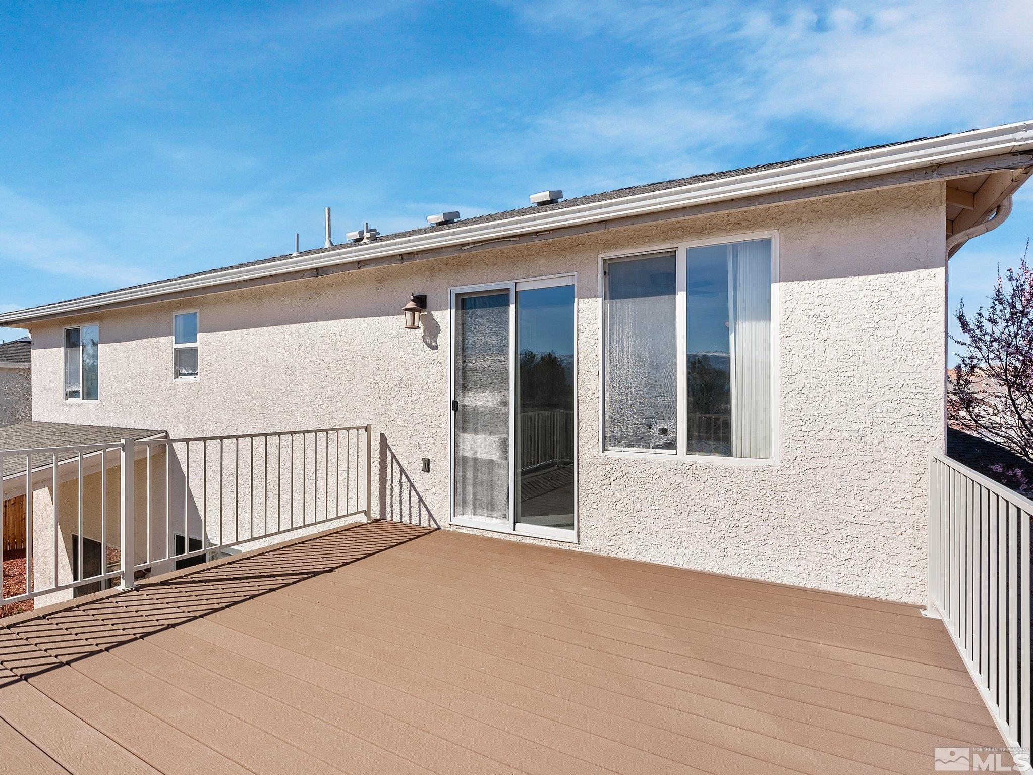 3451 Weaver Place Reno, NV 89512 - Photo 29 of 40 a view of a house with a wooden deck