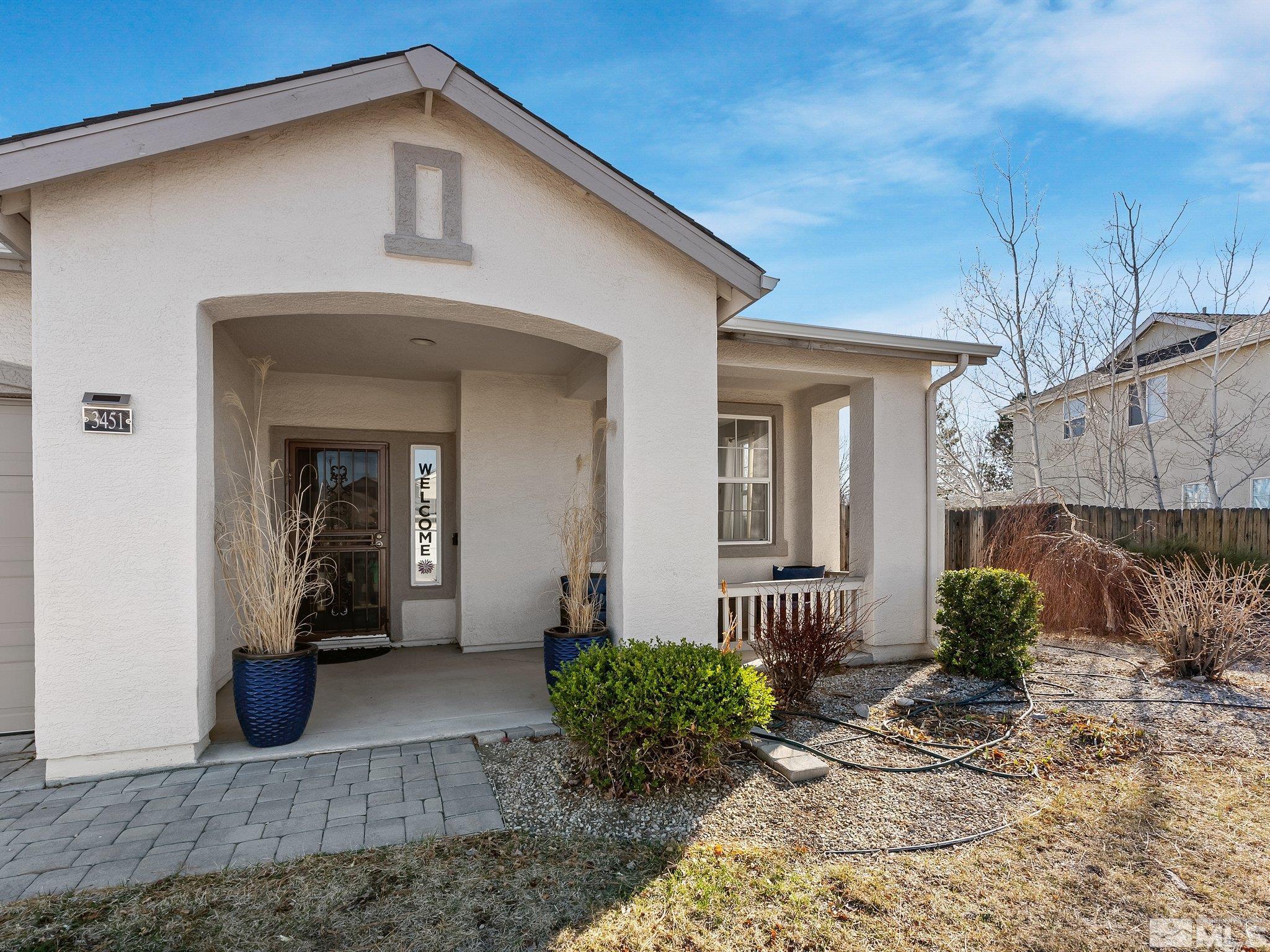 3451 Weaver Place Reno, NV 89512 - Photo 3 of 40 a front view of a house with garden