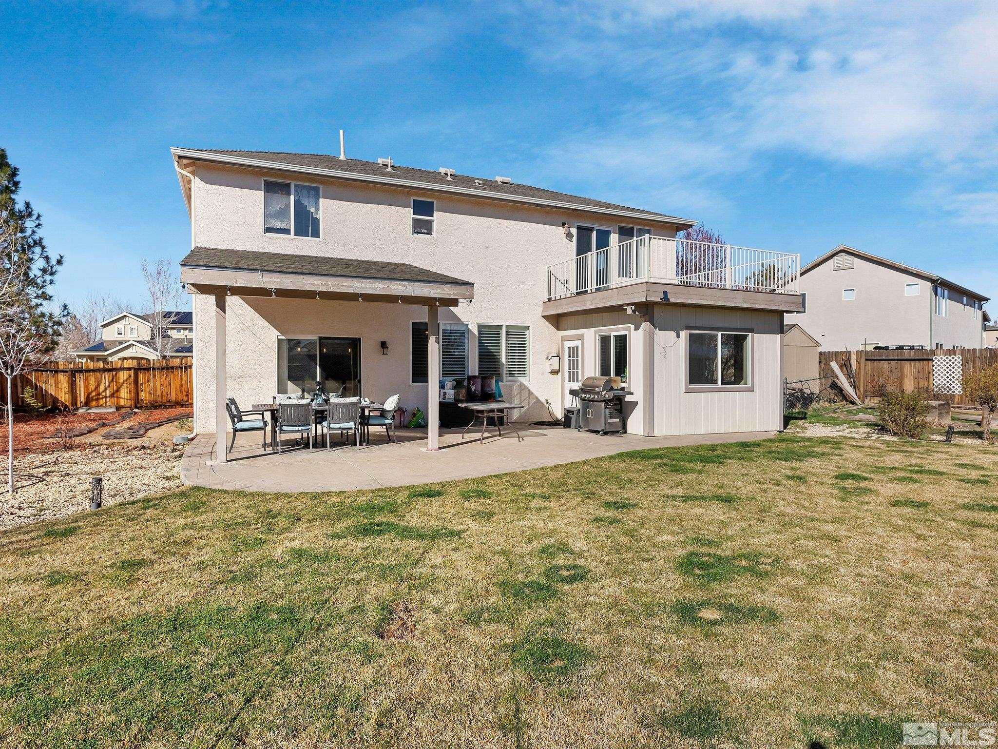 3451 Weaver Place Reno, NV 89512 - Photo 32 of 40 a view of a house with pool and chairs