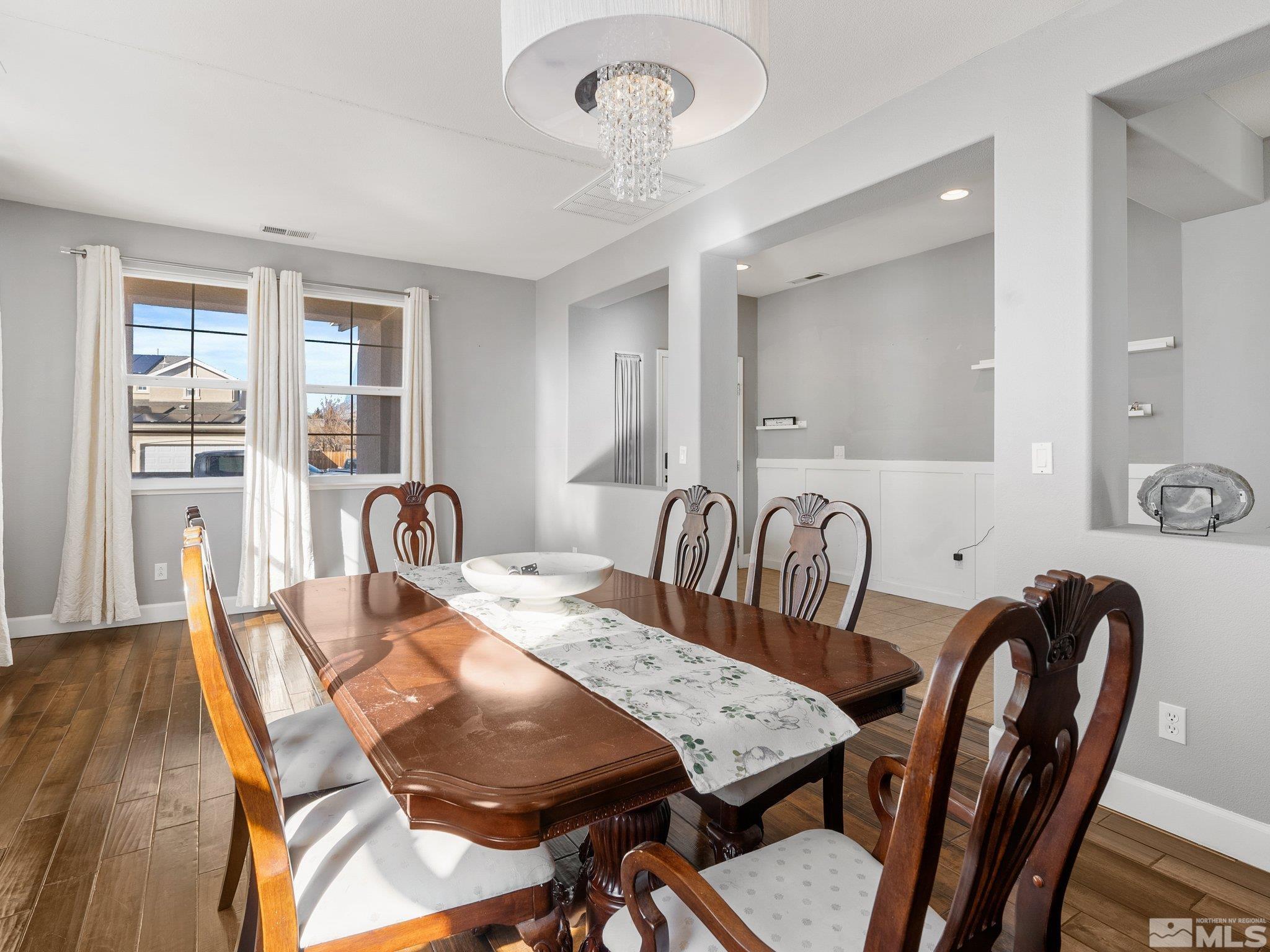 3451 Weaver Place Reno, NV 89512 - Photo 8 of 40 a view of a a dining room with furniture window and wooden floor