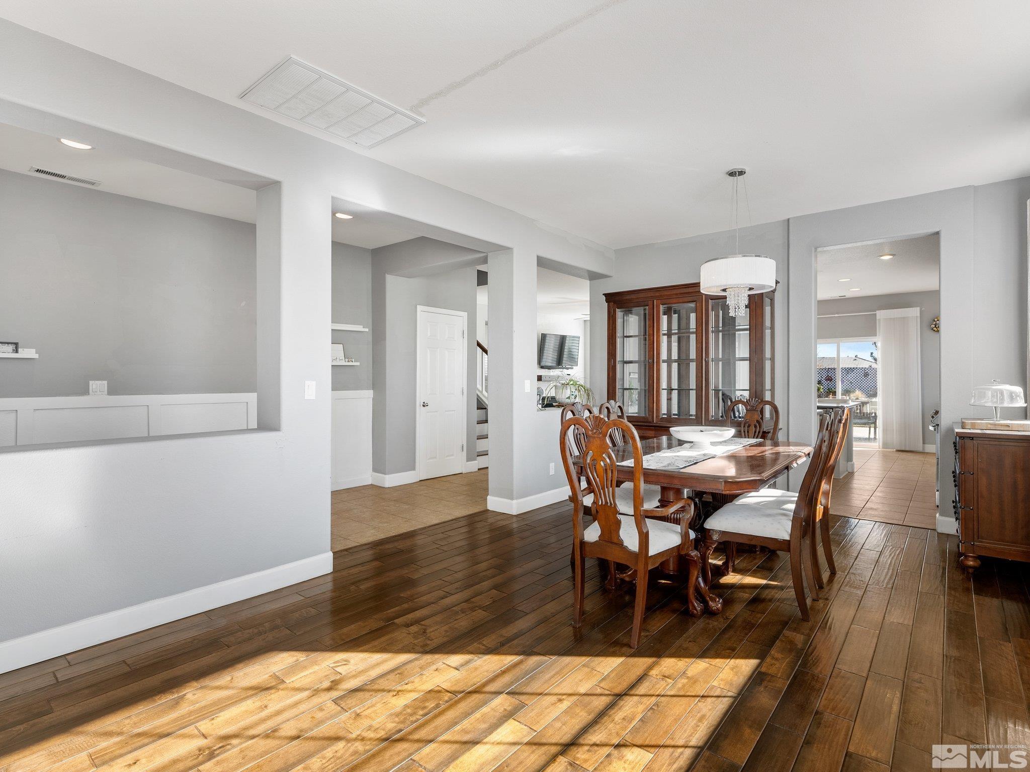 3451 Weaver Place Reno, NV 89512 - Photo 9 of 40 a dining room with furniture and wooden floor