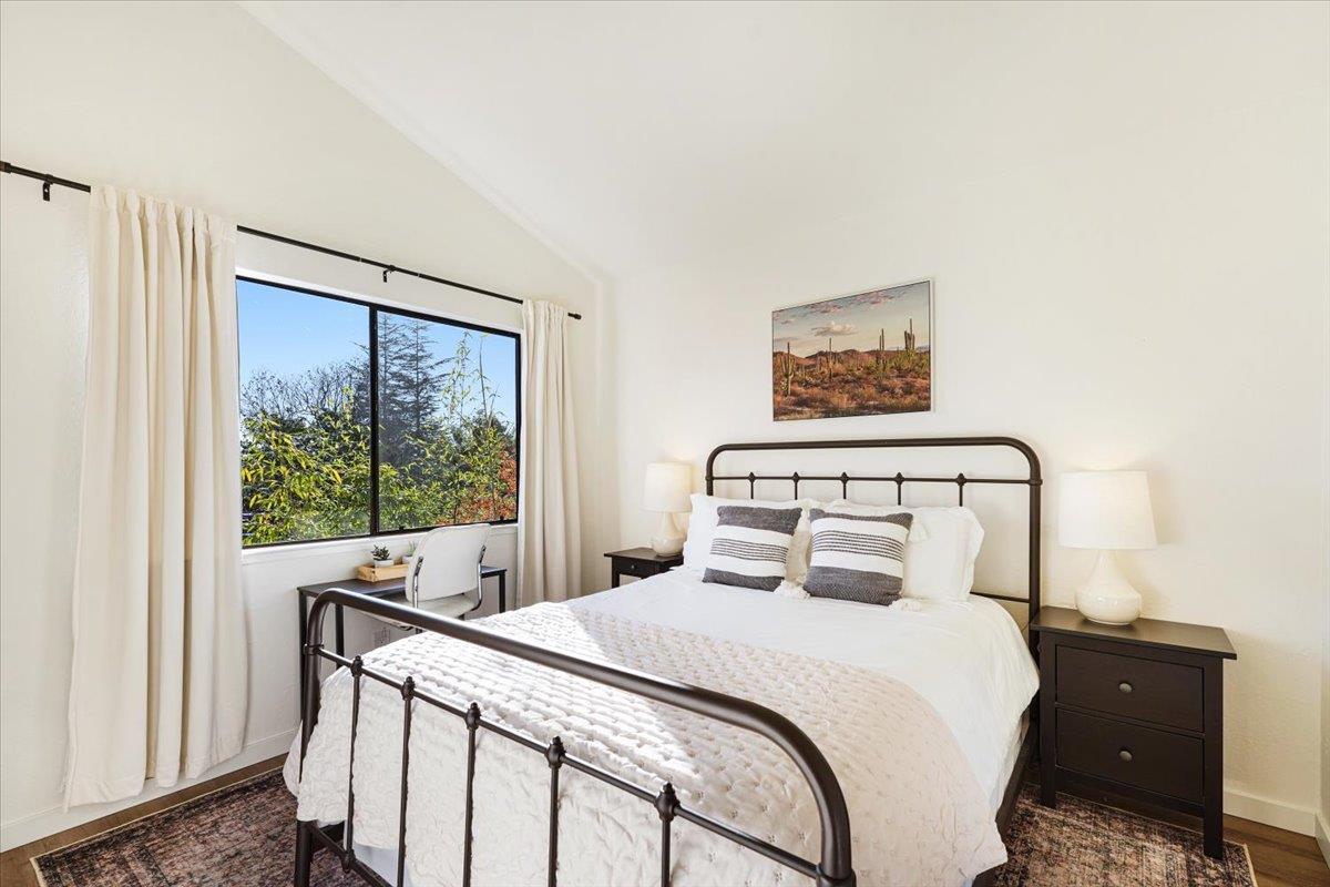 3003 Corte Cabrillo Aptos, CA 95003 - Photo 17 of 33 a bedroom with a large bed and a large window
