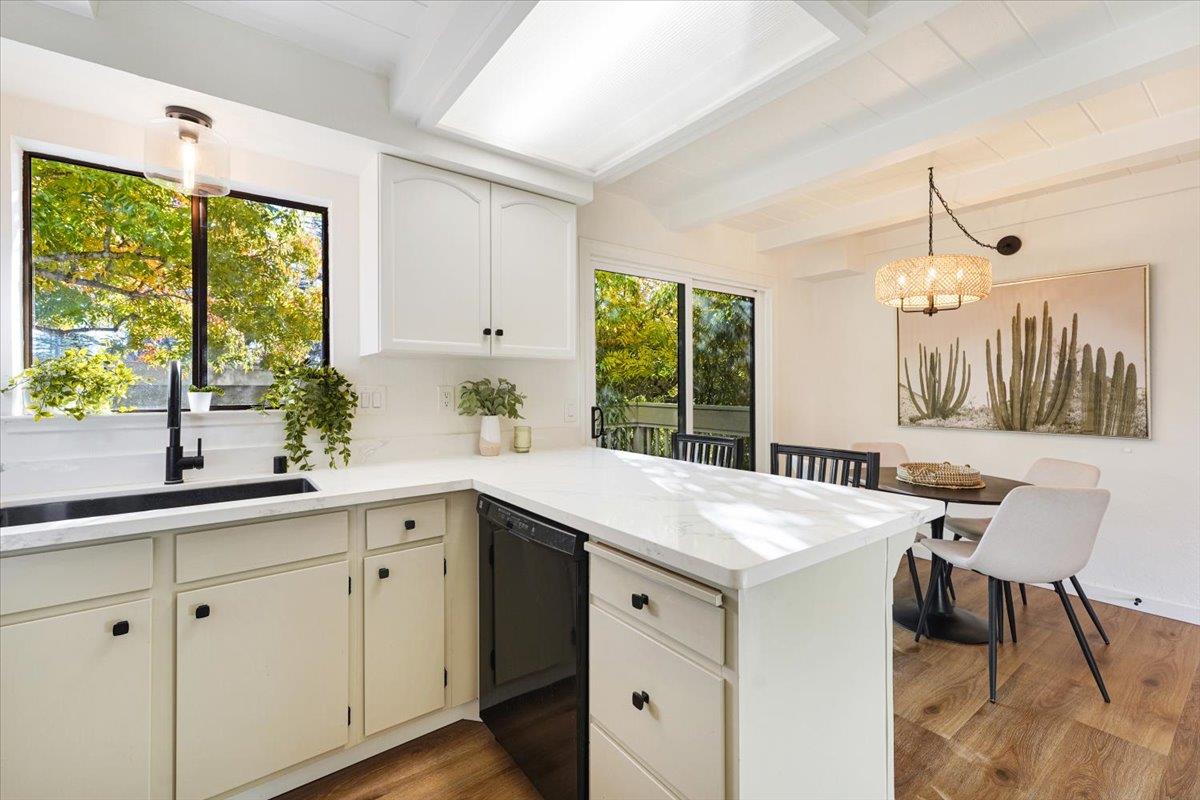 3003 Corte Cabrillo Aptos, CA 95003 - Photo 10 of 33 a kitchen that has a sink and a table in it