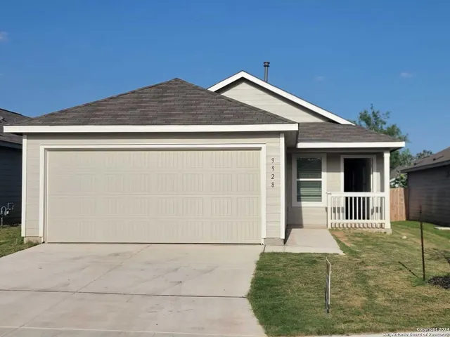 a front view of a house with garage