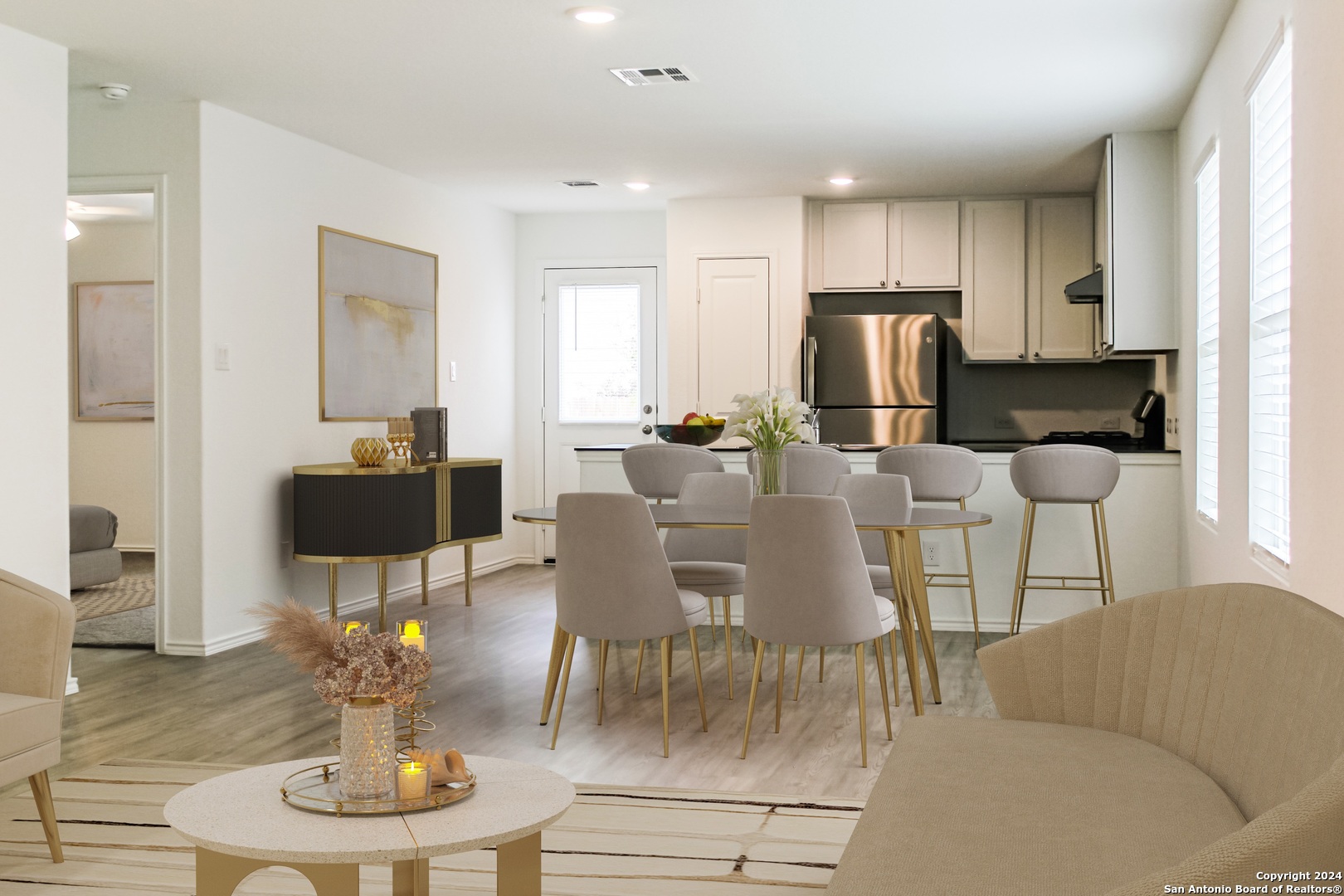 9928 Leeds Wheel San Antonio, TX 78254 - Photo 2 of 11 a living room with furniture a dining table and kitchen view