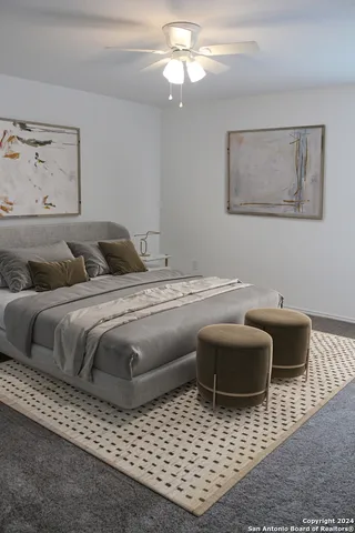 a bedroom with furniture and a rug